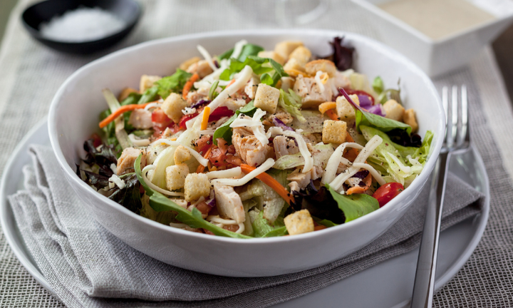 A colorful salad with croutons