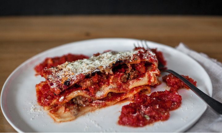 Lasagna with tomato sauce and grated cheese